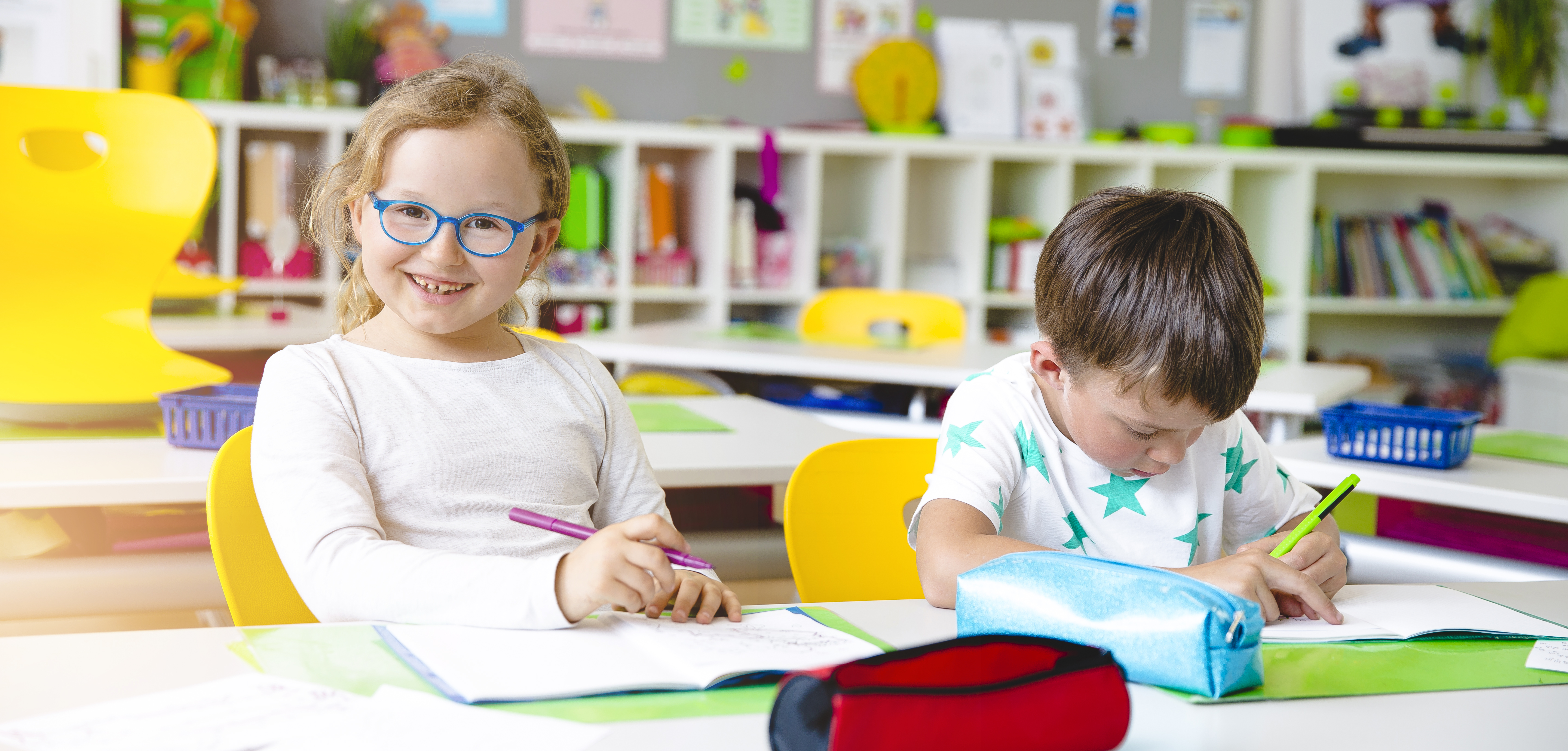 oy-girl-studying-desk-classroom.jpg