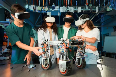 group-young-people-vr-glasses-doing-experiments-robotics-laboratory-robot-table.jpg